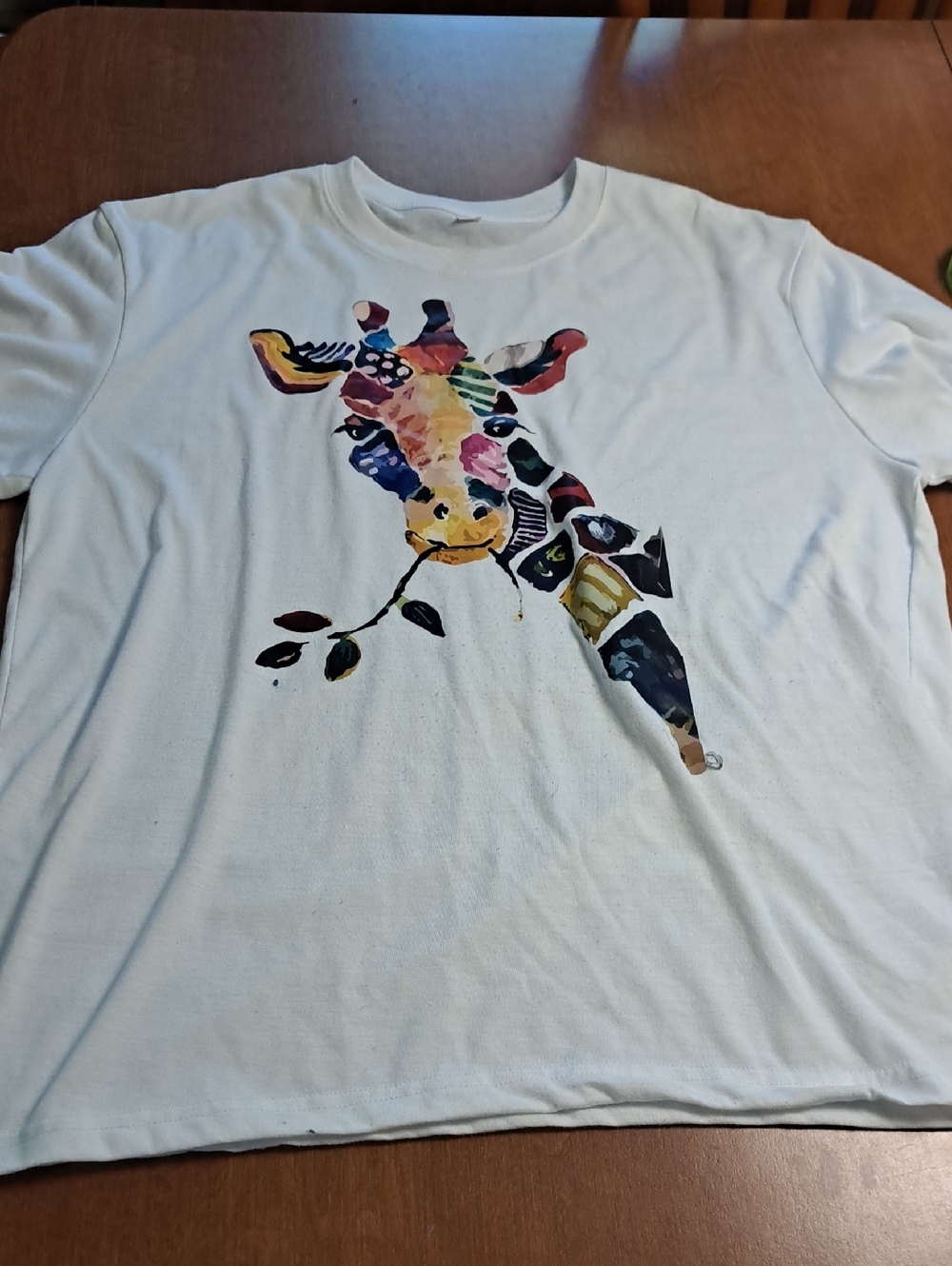 White Tee with Colorful Watercolor Giraffe Graphic